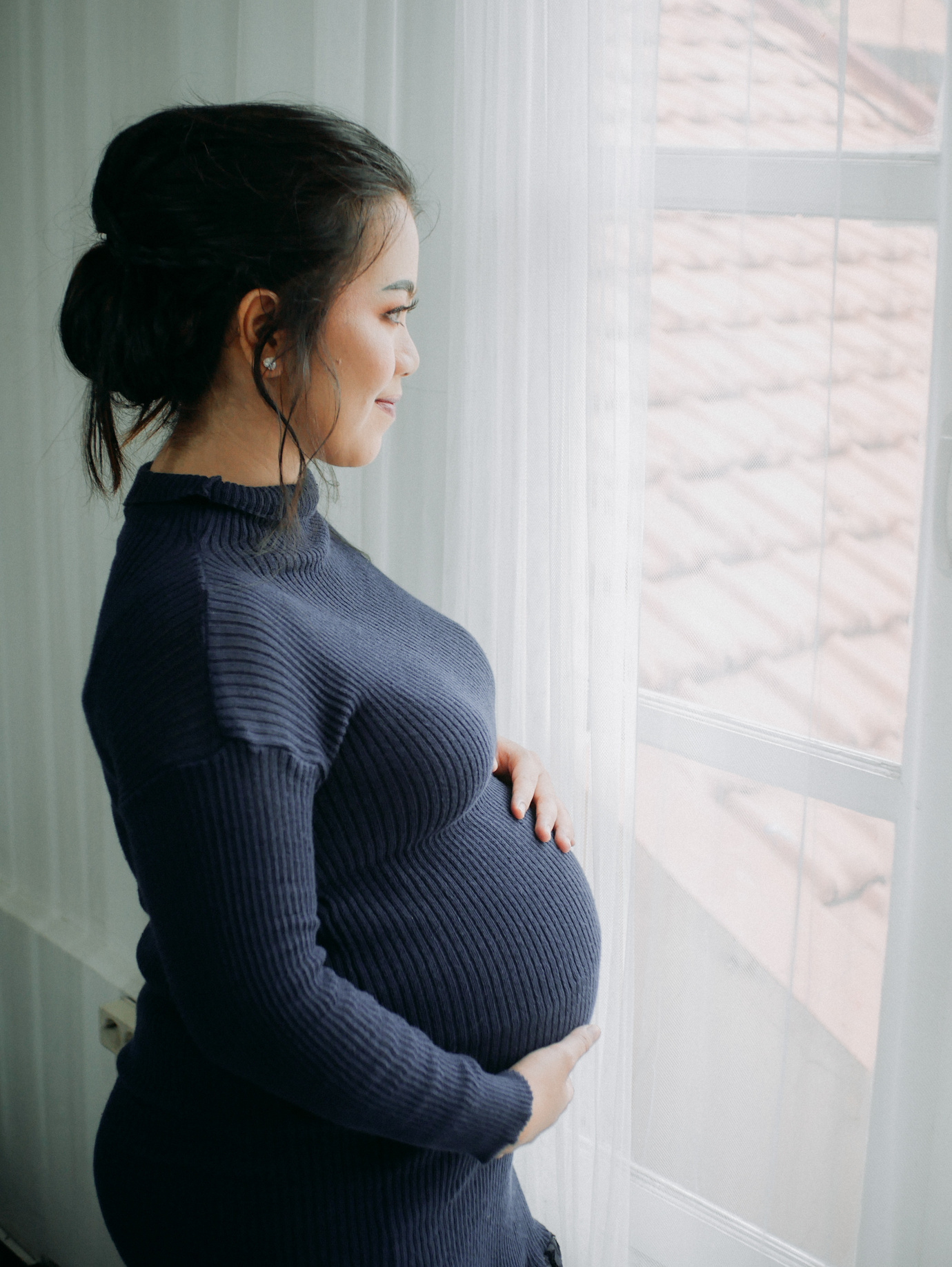A Side View of a Pregnant Woman in Knitted Sweater